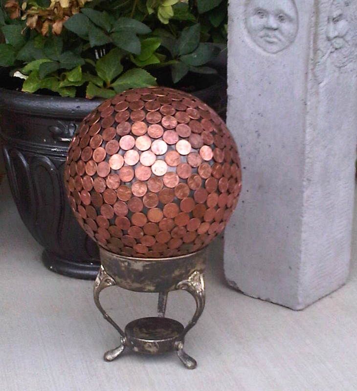 Penny bowling ball yard art