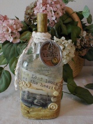 altered art bottle. i would like this on my plant shelves.