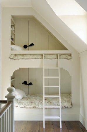 Attic room. love the shelves at the head of the beds. And that they are white, o...