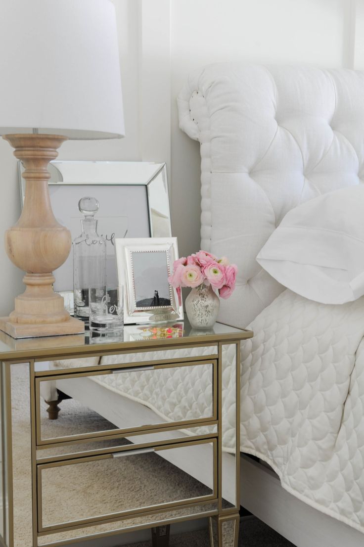 Beautiful bedroom.  Mirrored nightstand and accessories, White tufted headboard,...