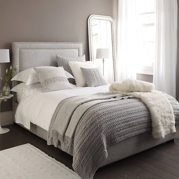 Gray and white bedroom.  Love the simple coloring and use of texture. It looks s...