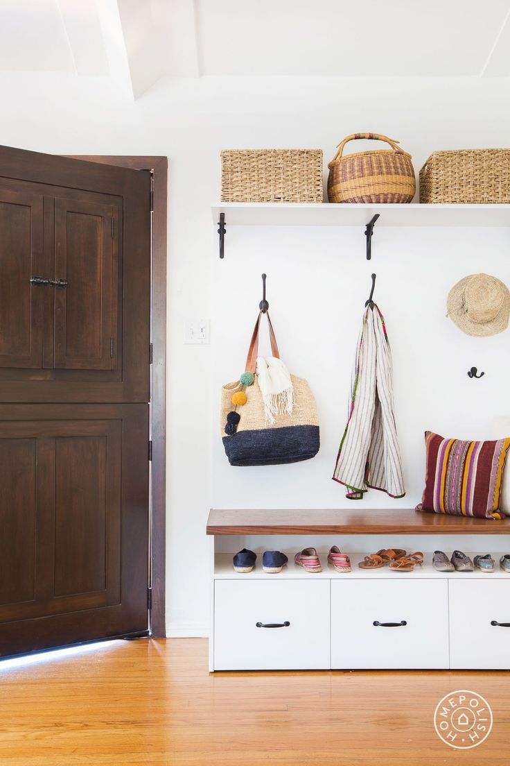 Entryway bench with wall storage baskets
