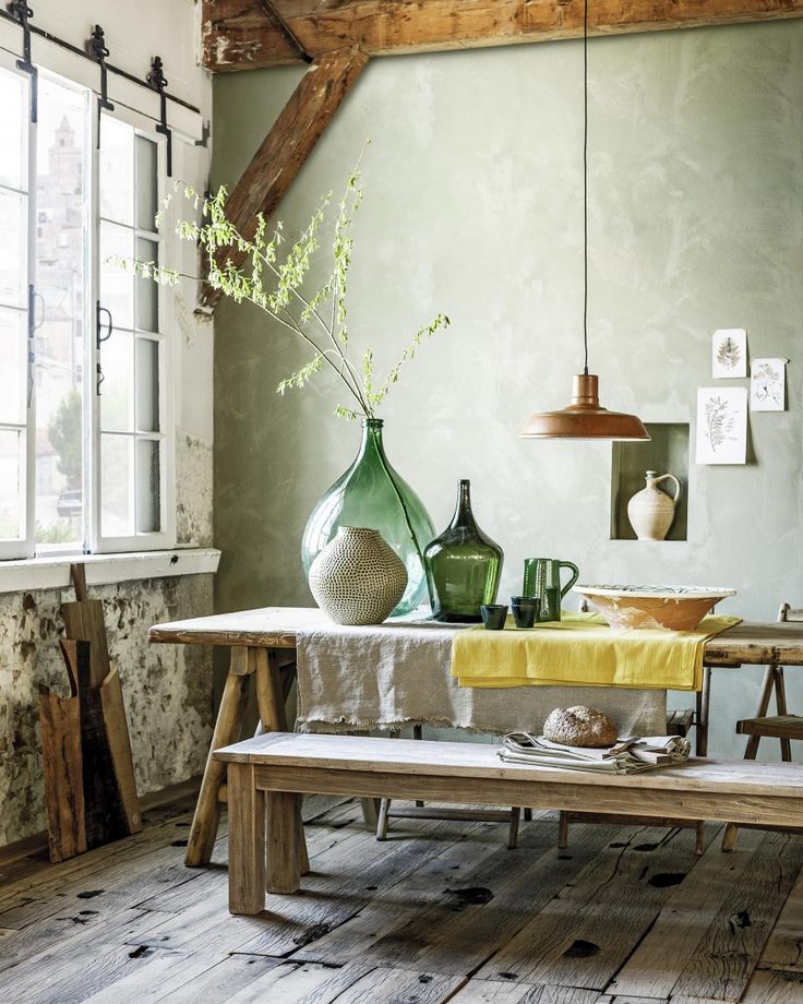 Tuscan dining room with weathered wood, pottery and Chianti-green bottles | Styl...