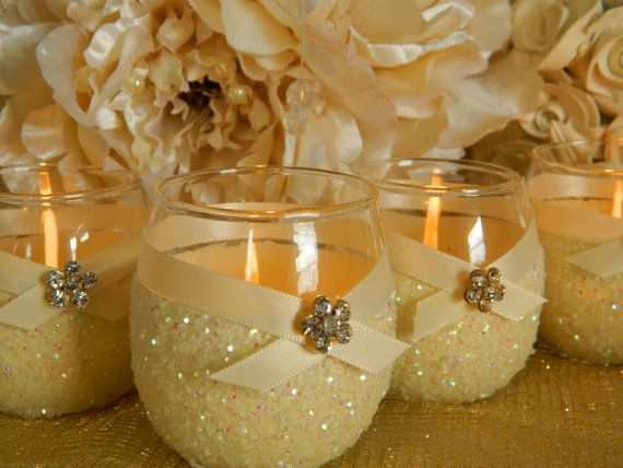 I could make these by dipping a candle holder in glue and glitter and putting ri...