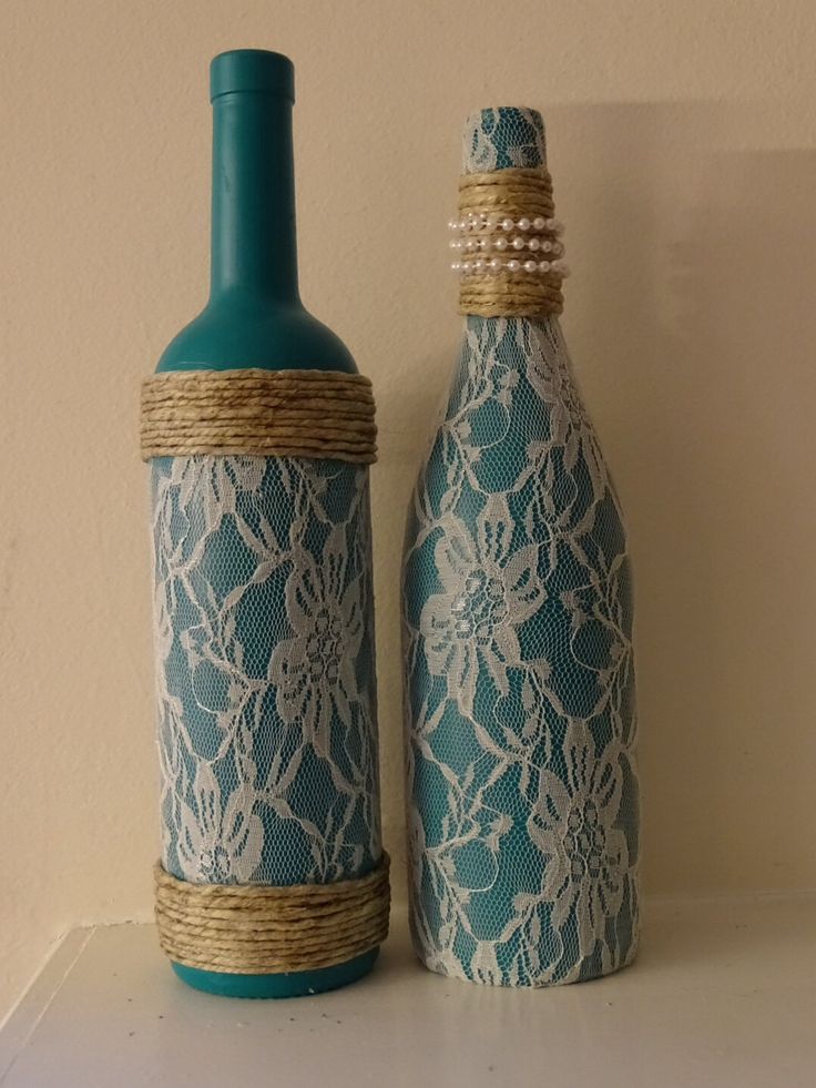 Lace, pearl, and twine adorned teal wine bottles, set of two