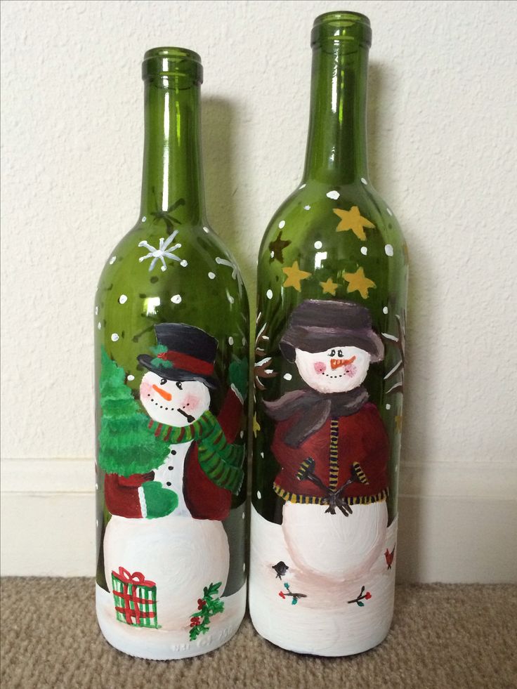 Mr. and Mrs. Snowman painted on wine bottles with acrylic