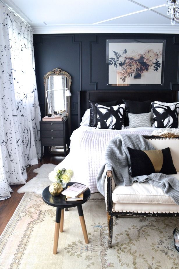 Wall-to-wall paint-splattered curtain panels to hide off-center windows; black w...