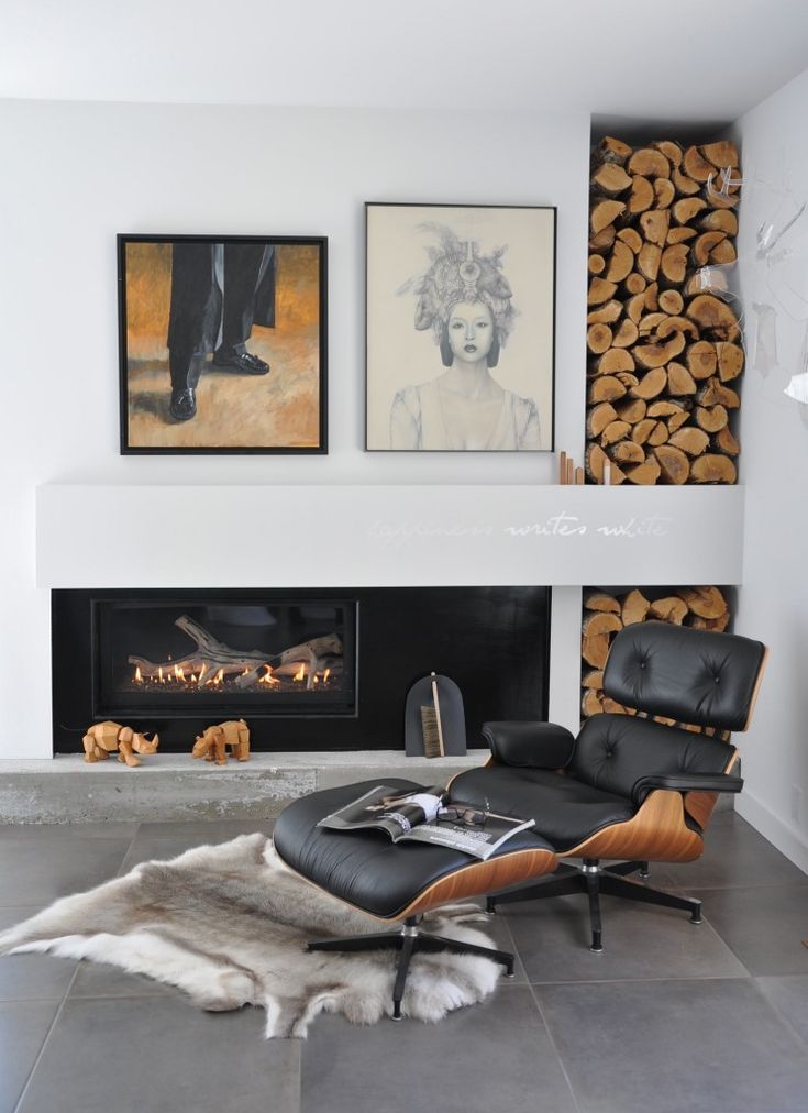 Lounging in luxury: Eames chair, hide rug, fireplace