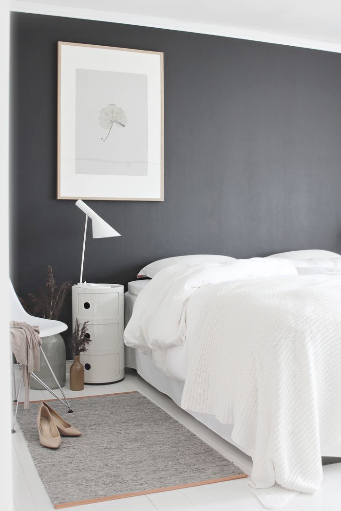 Kartell, White, grey and a design lamp creates a basic Bedroom