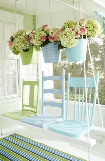 What a great idea for repurposing old chairs - a swing made from old broken chai...