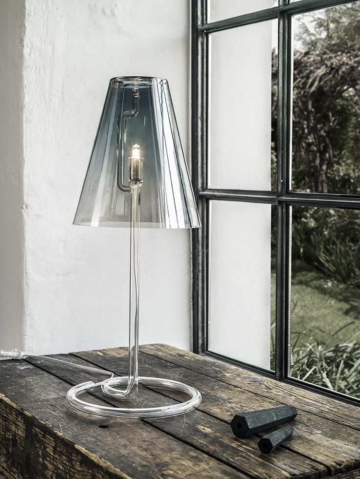 Hadovka lamp from Dechem. The stand is made from laboratory glass and it also...