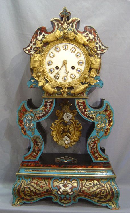 A most unusual and striking boulle clock. Decorated with ormolu mounts having bo...