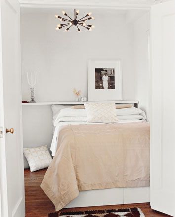 White bedroom + calm neutral palette + dramatic chandelier