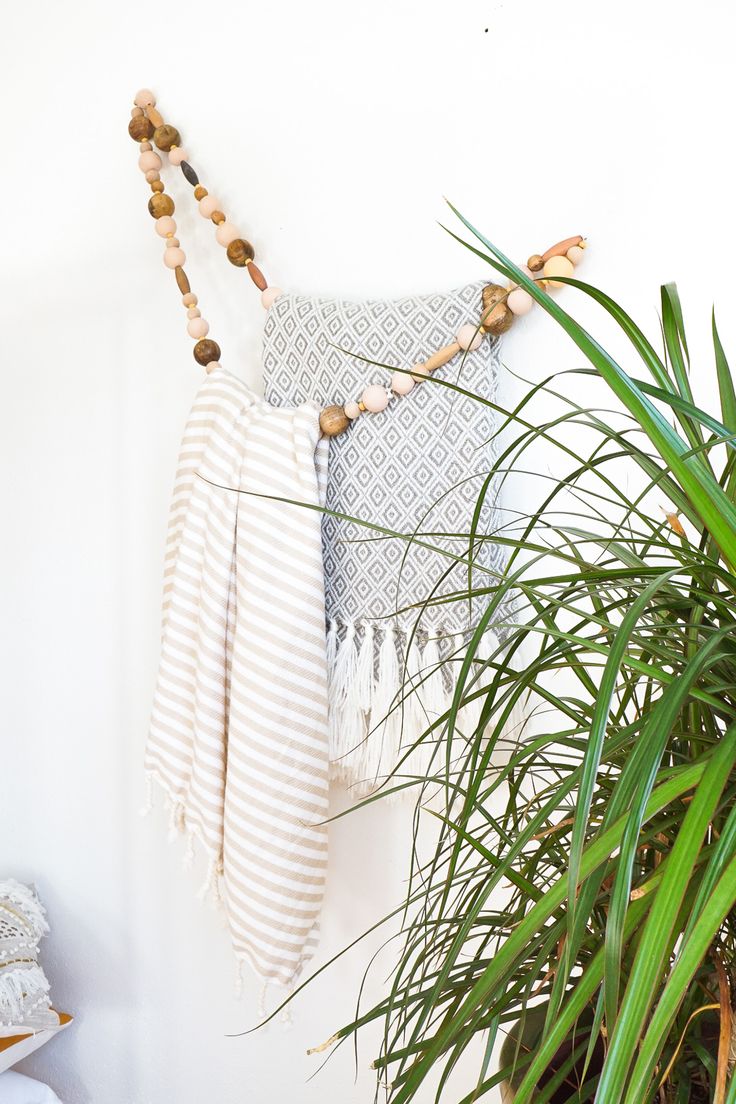 DIY Minimal Beaded Blanket Holder by top Houston lifestyle blogger Ashley Rose o...