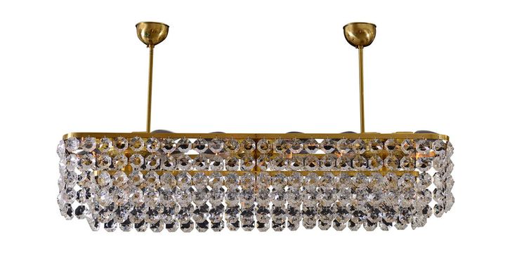 #DailyProductPick The Oberwalder Chandelier by Woka is made with brass and hand-...