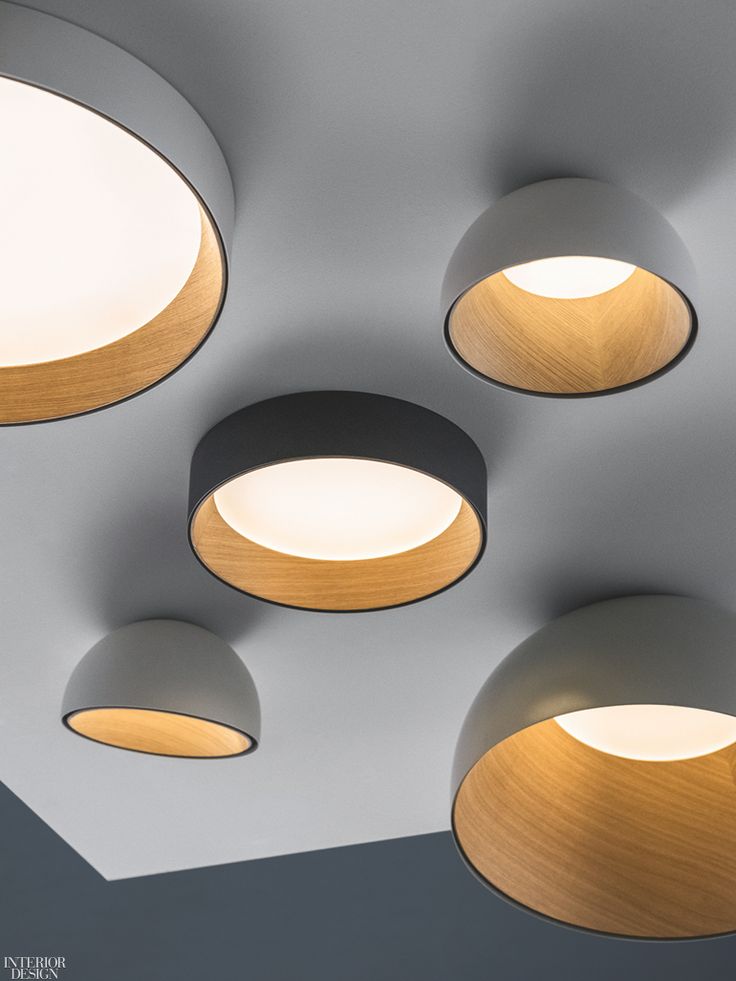 Duo ceiling fixtures in aluminum and oak by Vibia.