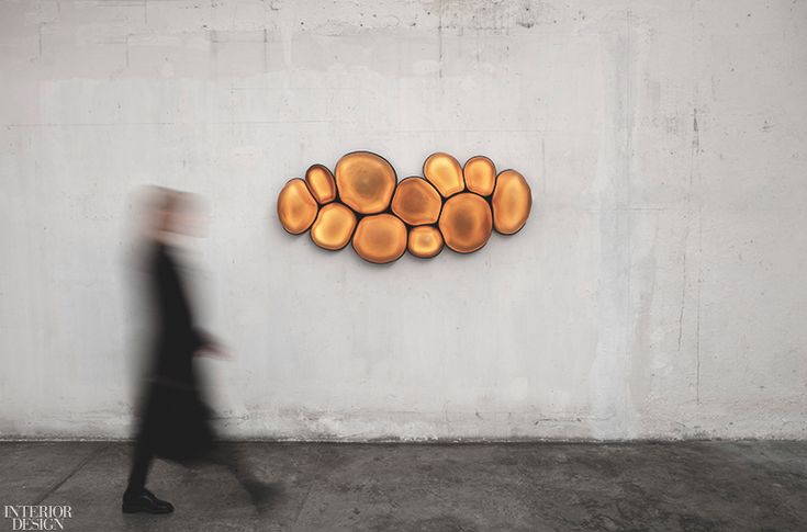 Magma wall sculpture in acid-finished amber glass and brass by Nouvel Limited.