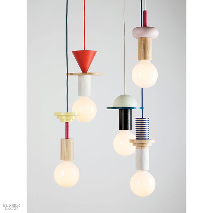 Painted ash elements, milky glass globes, and eight cord colors yield endless co...