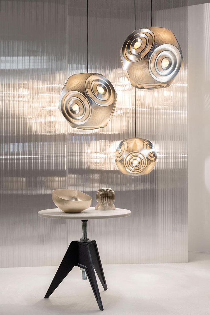 Tom Dixon fabricates the Curve Ball Pendant by laser cutting thin metal sheets