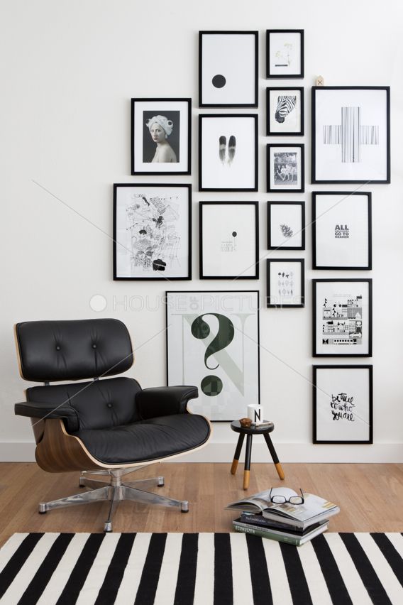 Black and white art printing, iconic midcentury black leather armchair, cousy wo...