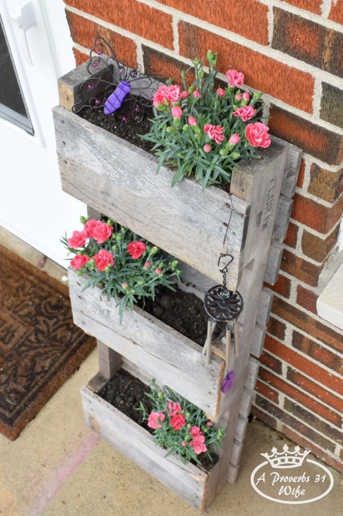Pallet turned planter to attract butterflies.