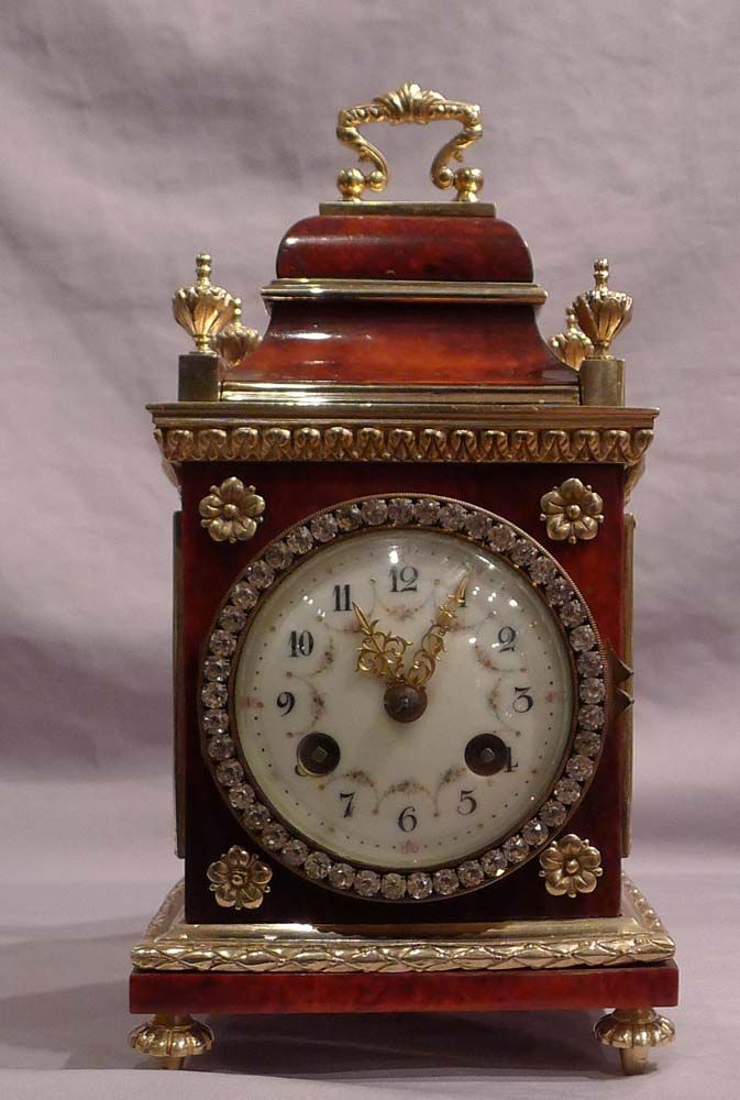 Antique miniature red tortoiseshell and bronze paste set mantel clock in early 1...