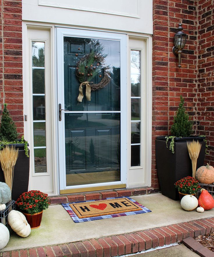 Decorate a Fall front porch with mums, pumpkins, and wheat--check out these prac...