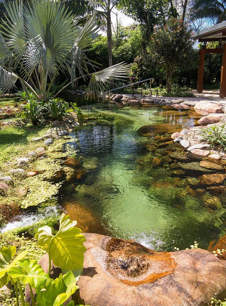 Natural Pool - designed by Peter Nitsche, with large, smooth granite boulders an...