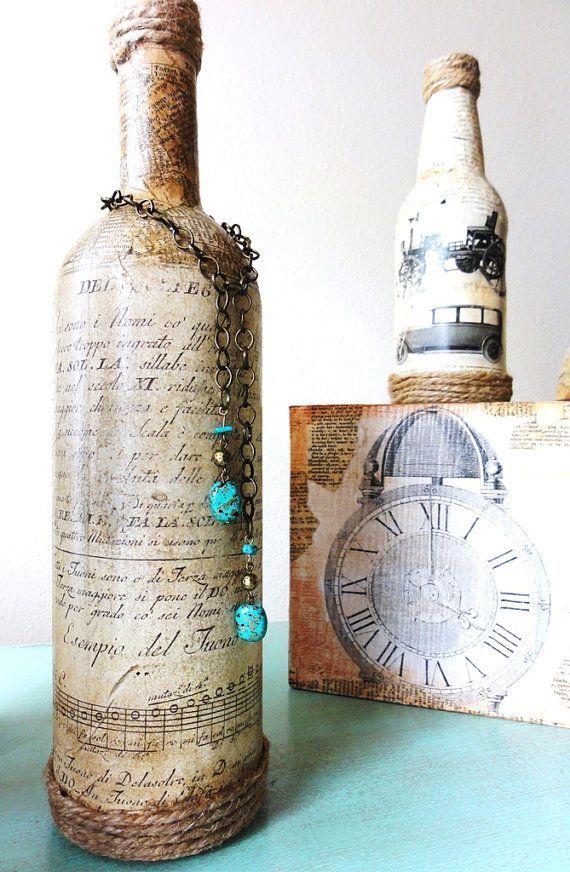 Decoupage, twine and trinkets make a wonderful display of upcycled wine bottles