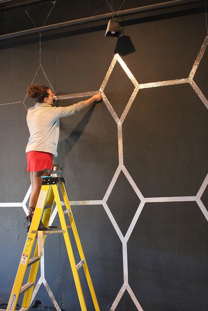 Use foil tape (Home Depot) to make a wall design.