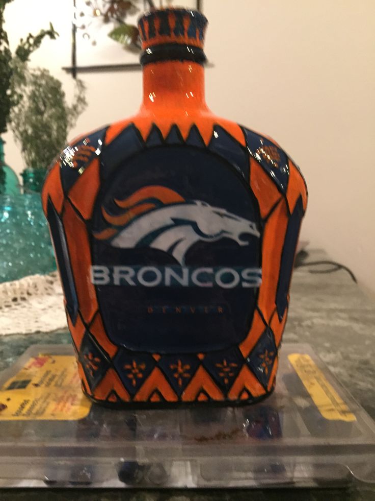 Broncos Crown Royal bottle. Spray painted, hand outlined, and decoupage image!!!
