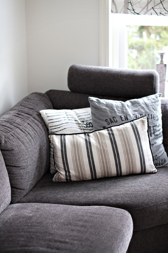gray couch fabric with assorted pillows