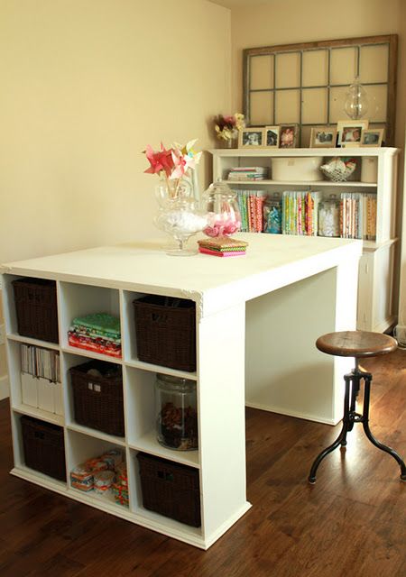 Two small bookshelves plus a thick board (painted white). Awesome crafting table...
