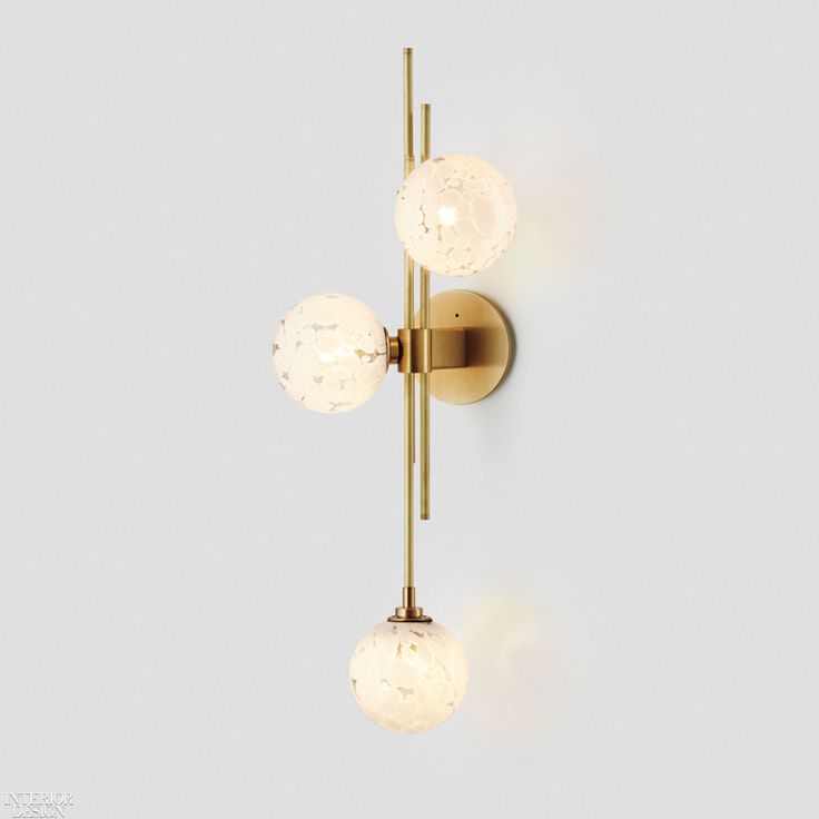 Nicci Green’s Trilogy sconce in mouth-blown glass and brass with Spoti white f...