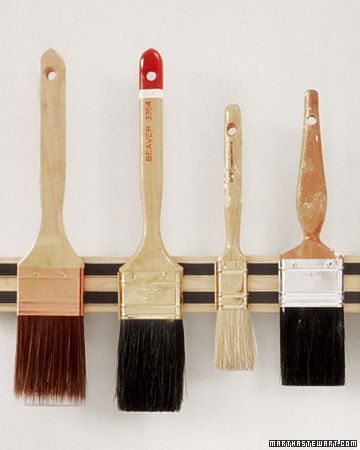 magnetic knife holders sold at kitchen-supply stores to hang paintbrushes! SWOON...