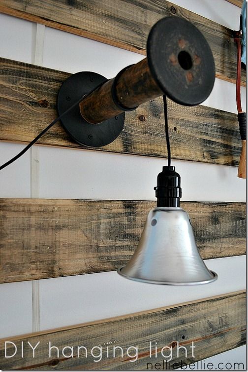 DIY light from shop light and wooden spool (or any kind of bracket). how cool is...