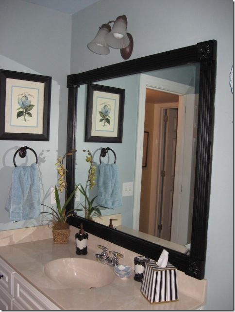 Frame those boring mirrors with wood and corner blocks. Inexpensive and easy wit...