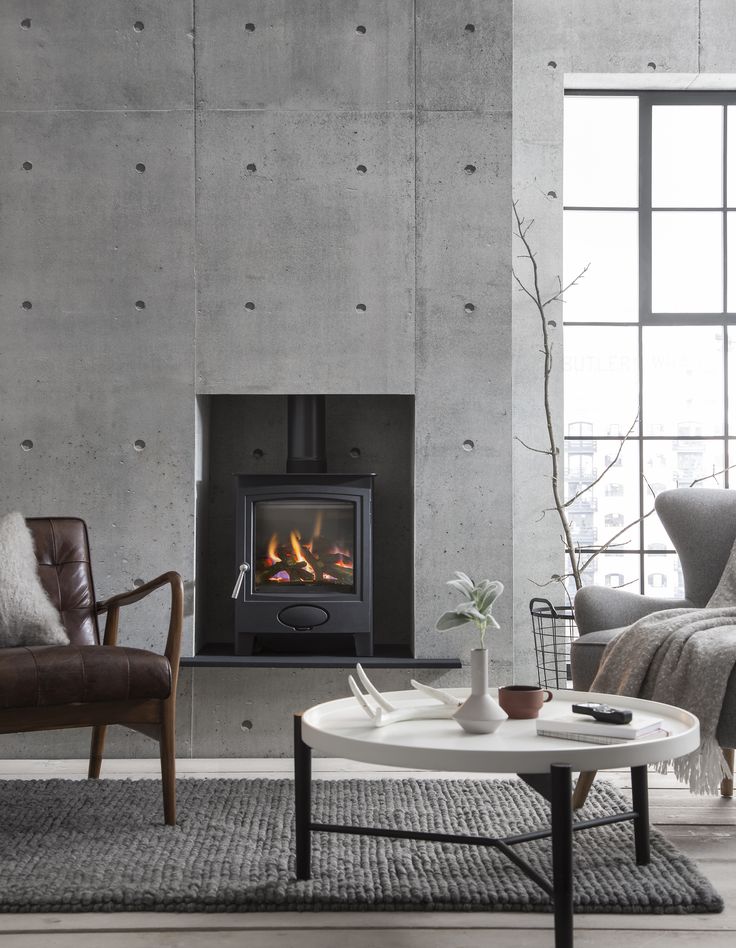 Contemporary wood burning stoves in a cosy Scandi interior - Arada stoves