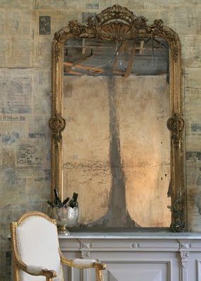 Mirror ~ love the stone wall too! on second look, I think this wall is covered w...