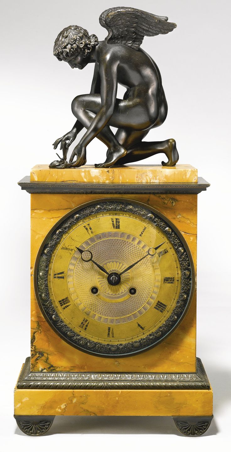 A Charles X patinated bronze and Siena marble mantel clock circa 1830.
