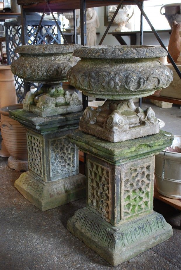 Antique English limestone urns with pedestals...