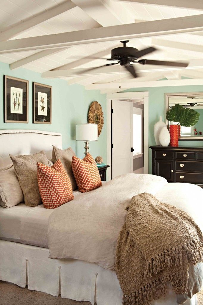 Sea foam, sand, drift wood & a pop of coral are the colors in this bedroom.