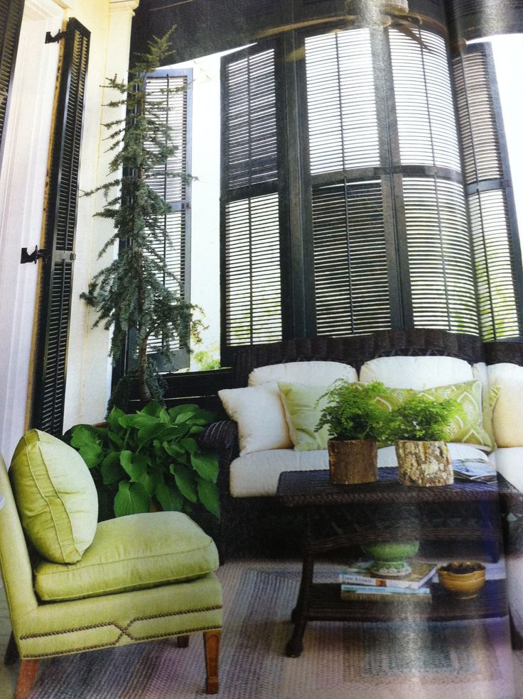 West Indies style enclosed porch, love th shutters & pop of color.