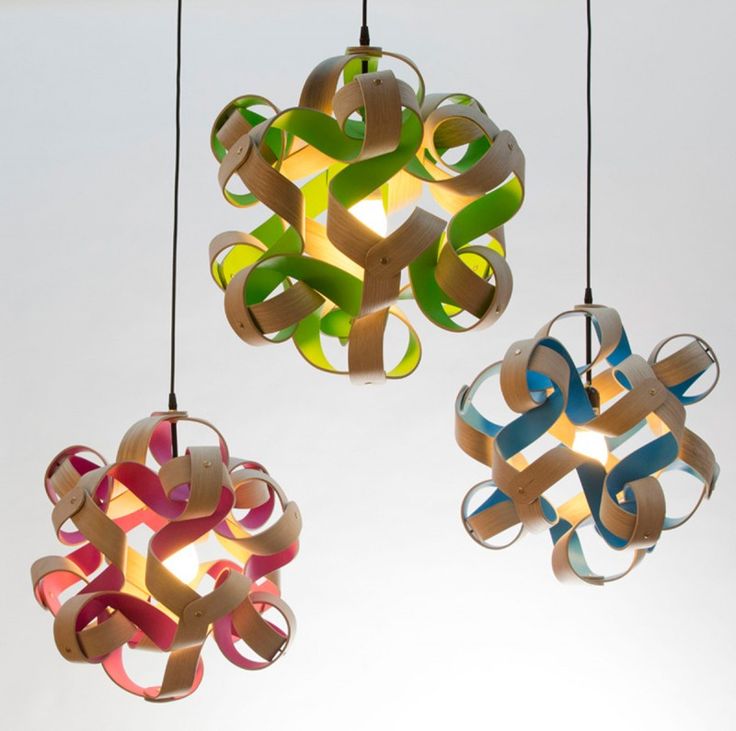 Curls Of Wood With Pops Of Color Surround These Lights