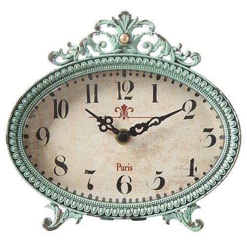 I love this little beauty!! Oval clock