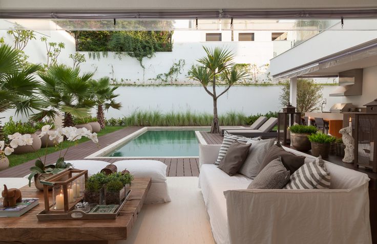 I'm daydreaming of spaces to soak in the sun... and this pool and patio look lik...