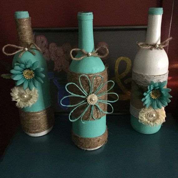 Decorated Wine Bottles Table Centerpiece by BowsAndTiesEvents