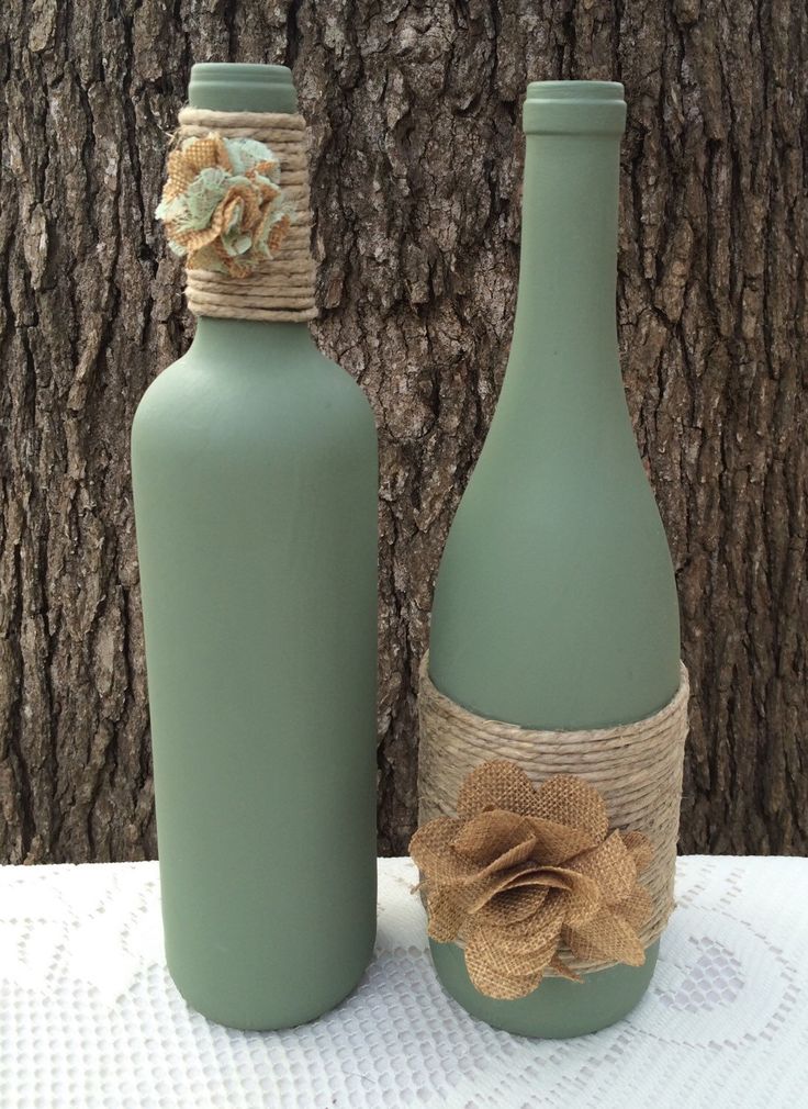 Sage hand painted wine bottles with twine and burlap flowers. Set of 2