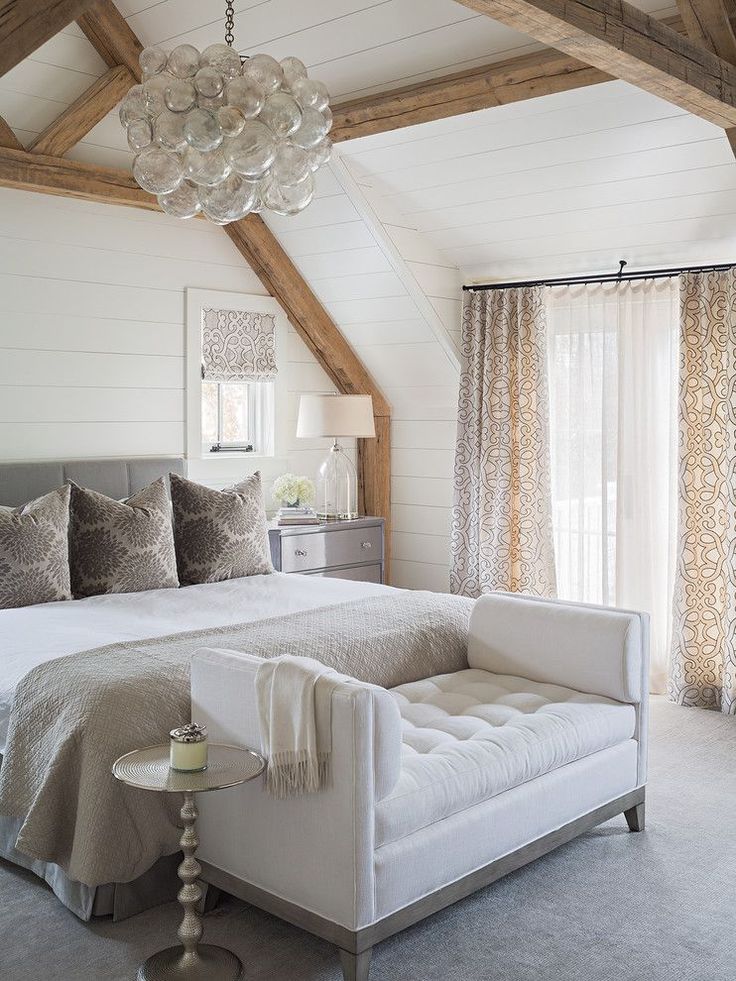 Elegant master bedroom with floor to ceiling shiplap, exposed wood beams, white ...