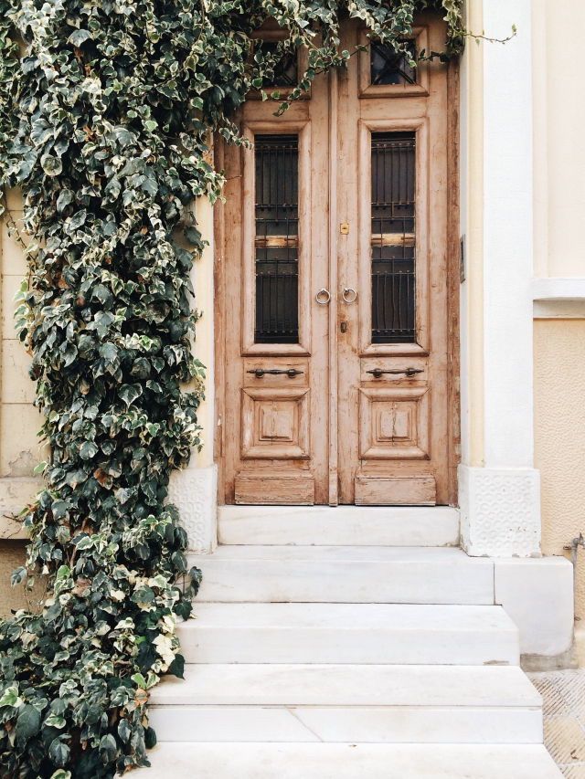 In love with this worn natural wood front door